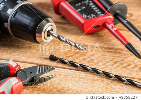 Carpentry tools on wooden surface 48859127