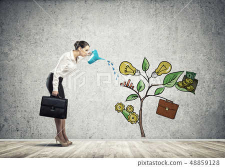 Young businesswoman in empty room watering drawn growth concept with can 48859128