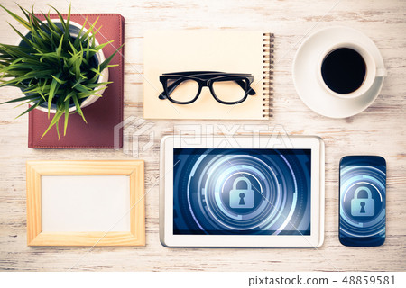 Web security and technology concept with tablet pc on wooden tab Web security and technology concept with tablet pc on wooden tab 48859581