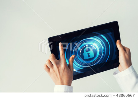 Close of female doctor hands working with tablet pc computer Close of female doctor hands working with tablet pc computer 48860667