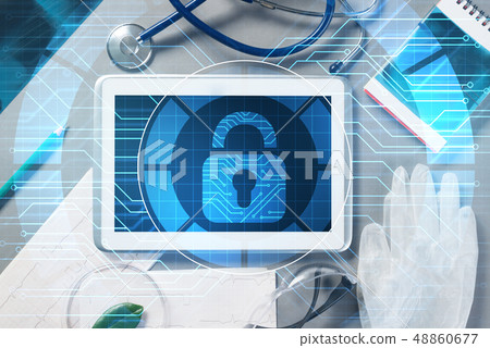 Top view of doctor workplace with tablet pc and medicine tools on wooden table Top view of doctor workplace with tablet pc and medicine tools on wooden table 48860677