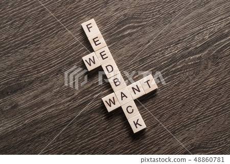 Conceptual media keywords on table with elements of game making crossword Conceptual media keywords on table with elements of game making crossword 48860781