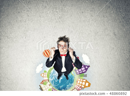 Businessman on Earth globe 48860892