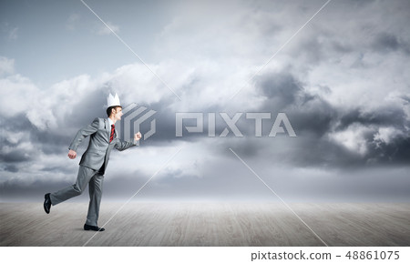 King businessman in elegant suit running and blue sky at background King businessman in elegant suit running and blue sky at background 48861075