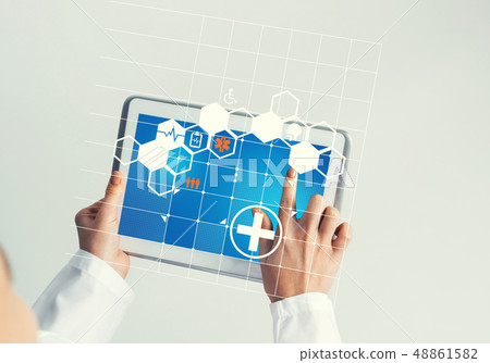 Close of female doctor hands working with tablet pc computer Close of female doctor hands working with tablet pc computer 48861582