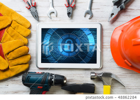 Web security and technology concept with tablet pc on wooden table 48862284