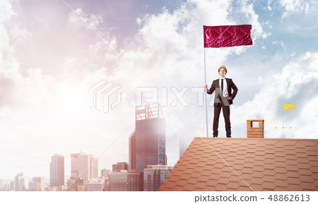 Young businessman with flag presenting concept of leadership. Mixed media 48862613
