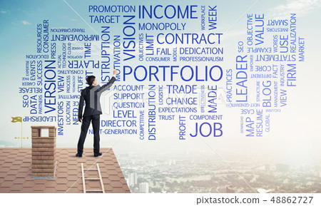 Young businessman standing on house roof and writing leadership 48862727