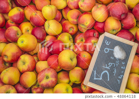 Red and yellow apples and blackboard with price Red and yellow apples and blackboard with price 48864118