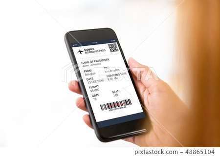 Passenger looking at electronic boarding pass on 48865104