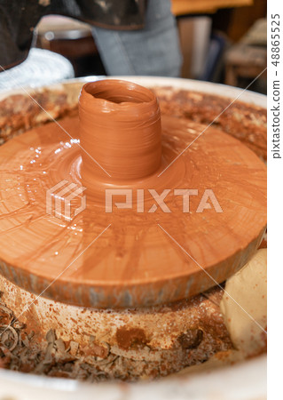 Craftsman hands making pottery bowl. Woman working on potter wheel . Family business shop sculpts 48865525