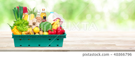 Fresh food and groceries in tray box on wood 48866796