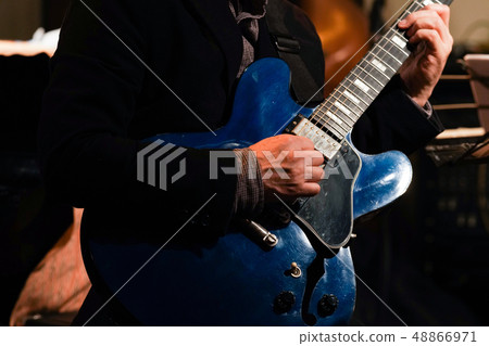 Guitar play (focus on the right hand) 48866971