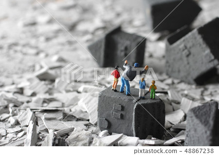  People staring at broken houses and rubble in a disaster 48867238