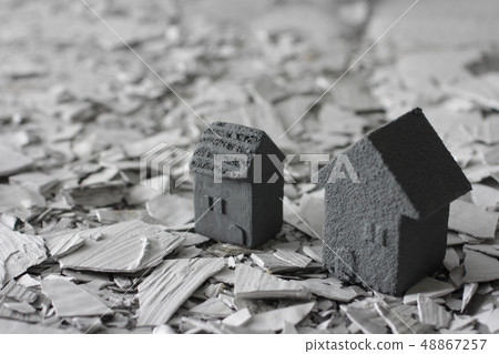  People staring at broken houses and rubble in a disaster 48867257