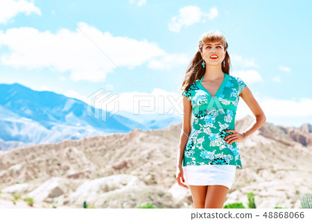 girl on background of mountains girl on background of mountains 48868066