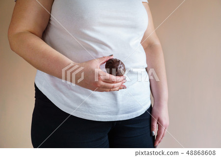 overweight woman with unhealthy fattening food overweight woman with unhealthy fattening food 48868608