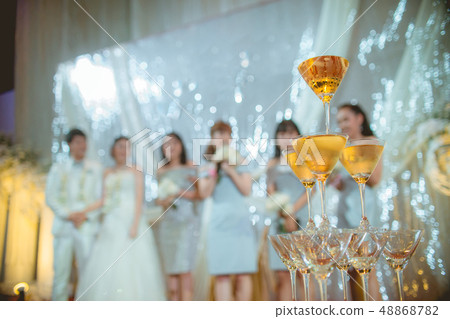 Glasses of alcoholic stacked on night wedding. Glasses of alcoholic stacked on night wedding. 48868782