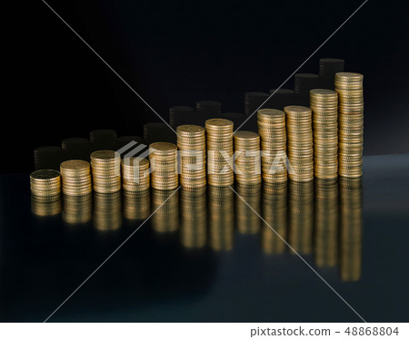 A chart of twelve stacks of gold coins A chart of twelve stacks of gold coins 48868804