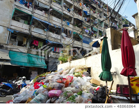 Garbage mountain in a backyard of a market place Garbage mountain in a backyard of a market place 48868864