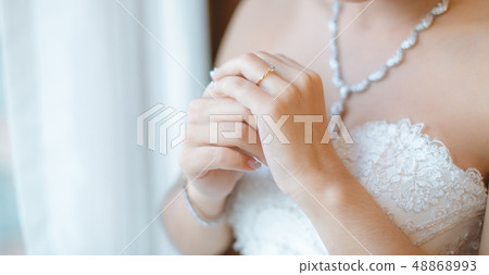Beautiful bride hold her ring. Beautiful bride hold her ring. 48868993