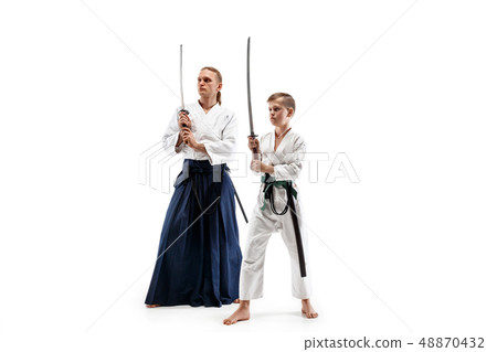 Man and teen boy fighting at aikido training in martial arts school 48870432