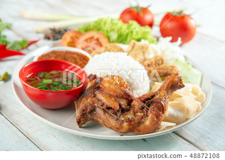 Nasi lemak kukus with fried drumstick 48872108
