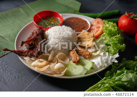 Nasi lemak kukus with quail meat Nasi lemak kukus with quail meat 48872114