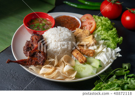 Nasi lemak kukus with quail meat Nasi lemak kukus with quail meat 48872118