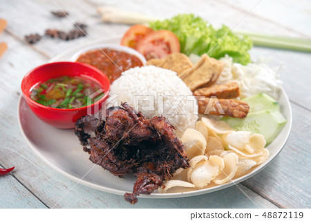 Nasi lemak kukus with quail meat Nasi lemak kukus with quail meat 48872119