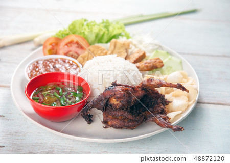 Nasi lemak kukus with quail meat 48872120