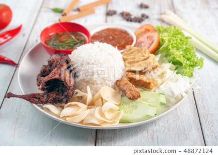 Nasi lemak kukus with quail meat 48872124