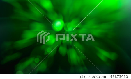 Light flare on abstract glowing light on a green background 48873610