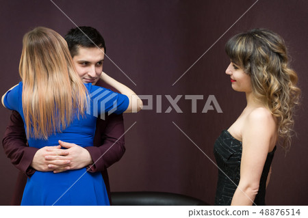 The girl is jealous of a young man to another 48876514