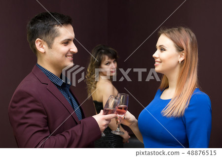 The girl is jealous of a young man to another The girl is jealous of a young man to another 48876515