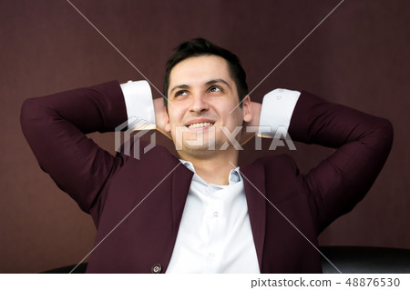 Successful young man in a suit. 48876530