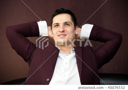 Successful young man in a suit. 48876532