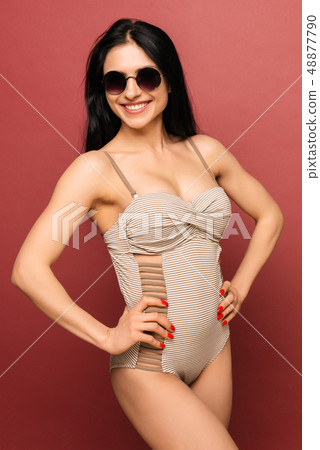 Cute smile girl in striped swimsuit Cute smile girl in striped swimsuit 48877790