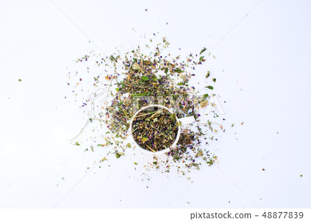 Cup of dry leaves herbal tea white background Cup of dry leaves herbal tea white background 48877839