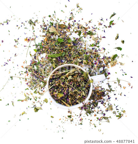 Cup of dry leaves herbal tea white background Cup of dry leaves herbal tea white background 48877841