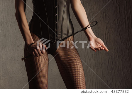 Sexy lady in bdsm outfit. Beauty dominant woman Sexy lady in bdsm outfit. Beauty dominant woman 48877882