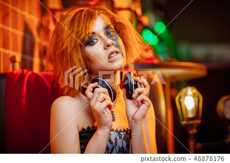 Girl in headphones at the disco Girl in headphones at the disco 48878176