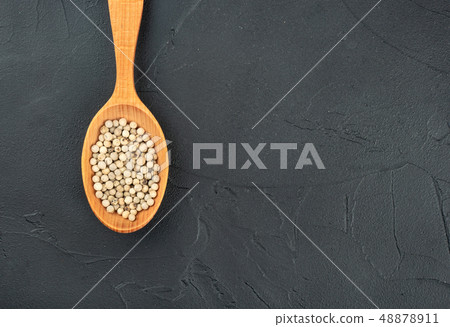 White pepper peas in spoon White pepper peas in spoon 48878911