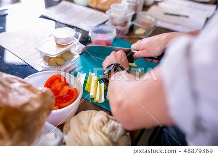 Cook cuts leek. Master class in the kitchen. The process of cooking. Step by step. Tutorial. Close Cook cuts leek. Master class in the kitchen. The process of cooking. Step by step. Tutorial. Close 48879369