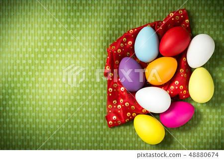Easter eggs lie on a green background 48880674