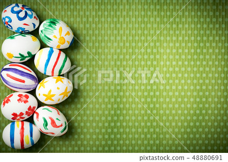 Easter eggs lie on a green background Easter eggs lie on a green background 48880691