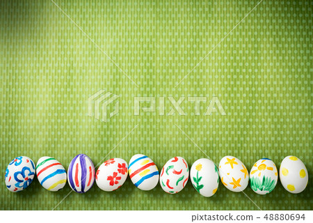 Easter eggs lie on a green background 48880694