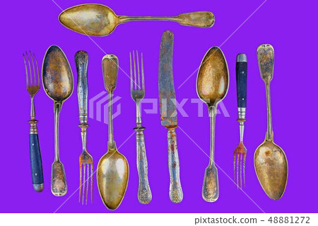 Vintage cutlery on a proton purple background. Top view. Crazy concept for culinary and modern life Vintage cutlery on a proton purple background. Top view. Crazy concept for culinary and modern life 48881272