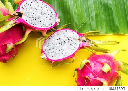 Pitahaya tropical fruits on yellow background. Raw 48885805