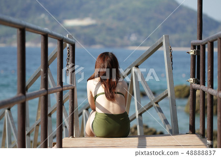 Portrait young asian female green sexy bikini back 48888837